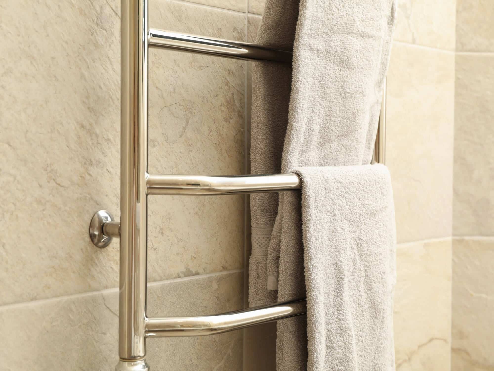 modern-heated-towel-rail-on-tiled-bathroom-wall-2021-08-31-14-52-58-utc-1